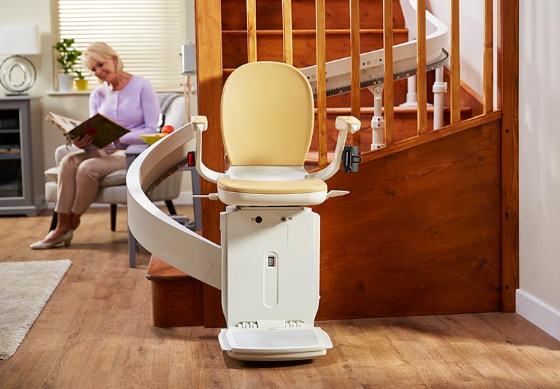 Acorn 180 curved stairlift and modular rail on an indoor staircase