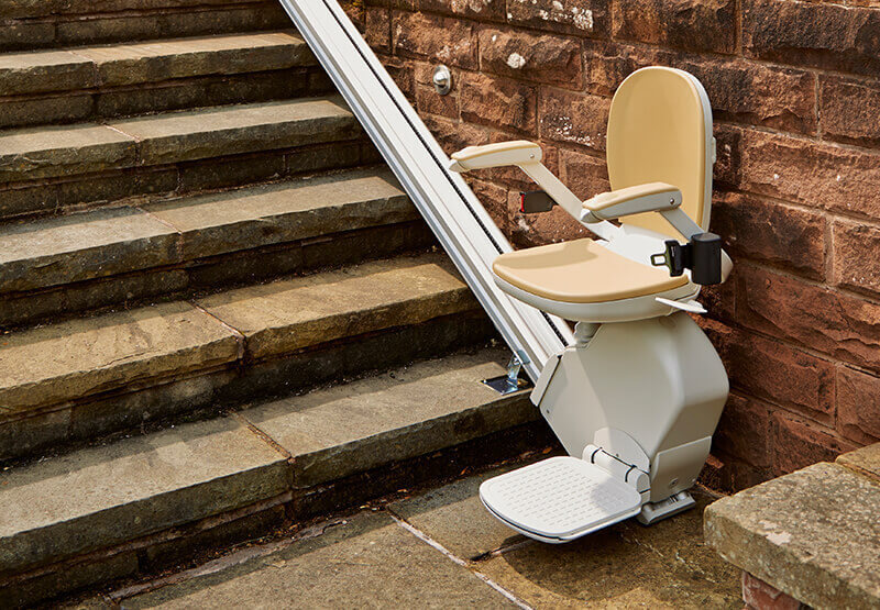 Acorn outdoor chair stairlift installed on exterior stone steps